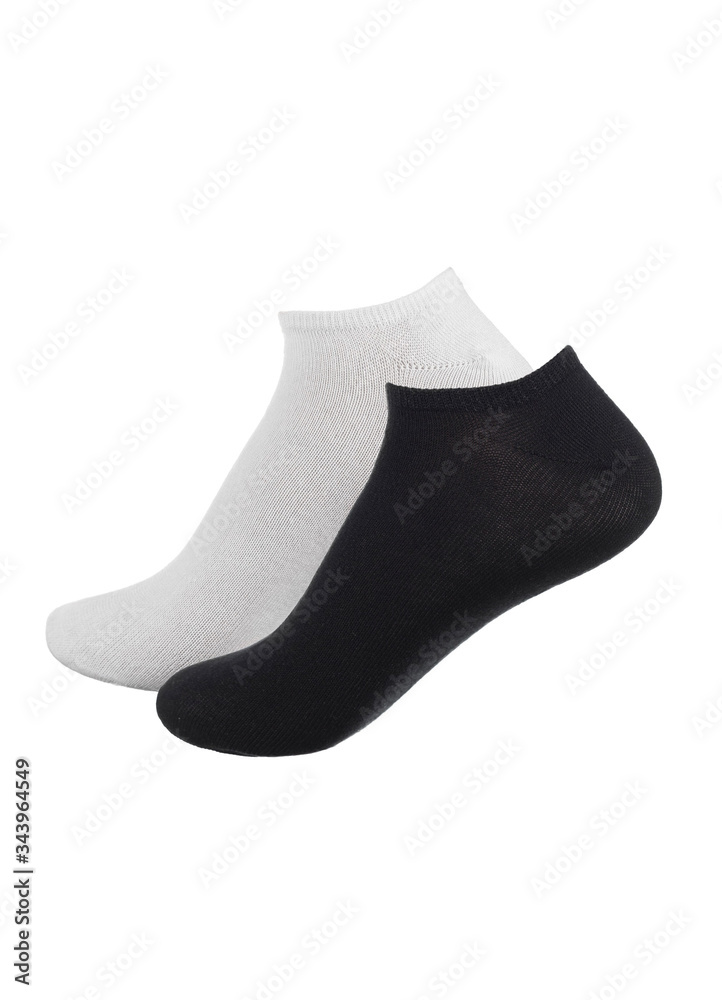 Set of socks white and black color isolated on white background. One pair of socks in different colors. Sock for sports on invisible foot as mock up for advertising, branding, design. Set of socks white and black color isolated on white background. One pair of socks in different colors. Sock for sports on invisible foot as mock up for advertising, branding, design.