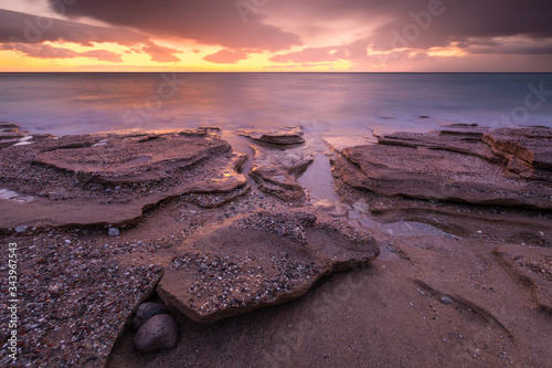 Sandstone rock formations on a beach near Goudouras village, Crete. photo