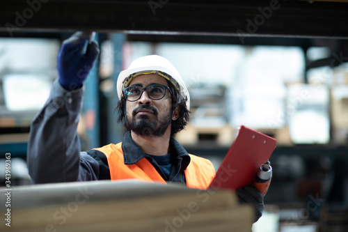 young store worker controlling ware