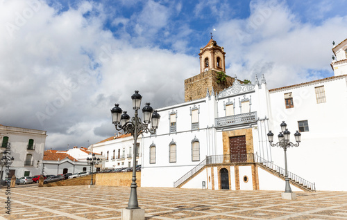 Constitution square and the facade of the church of Santa Maria de la Plaza in Fregenal de la Sierra town, province of Badajoz, Extremadura, Spain