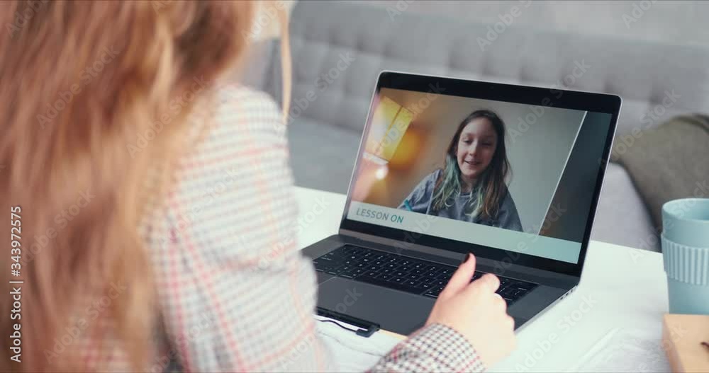 POV E-learning concept. Beautiful happy Caucasian teen girl talking to blonde female tutor on web conference call class. POV E-learning concept. Beautiful happy Caucasian teen girl talking to blonde female tutor on web conference call class.