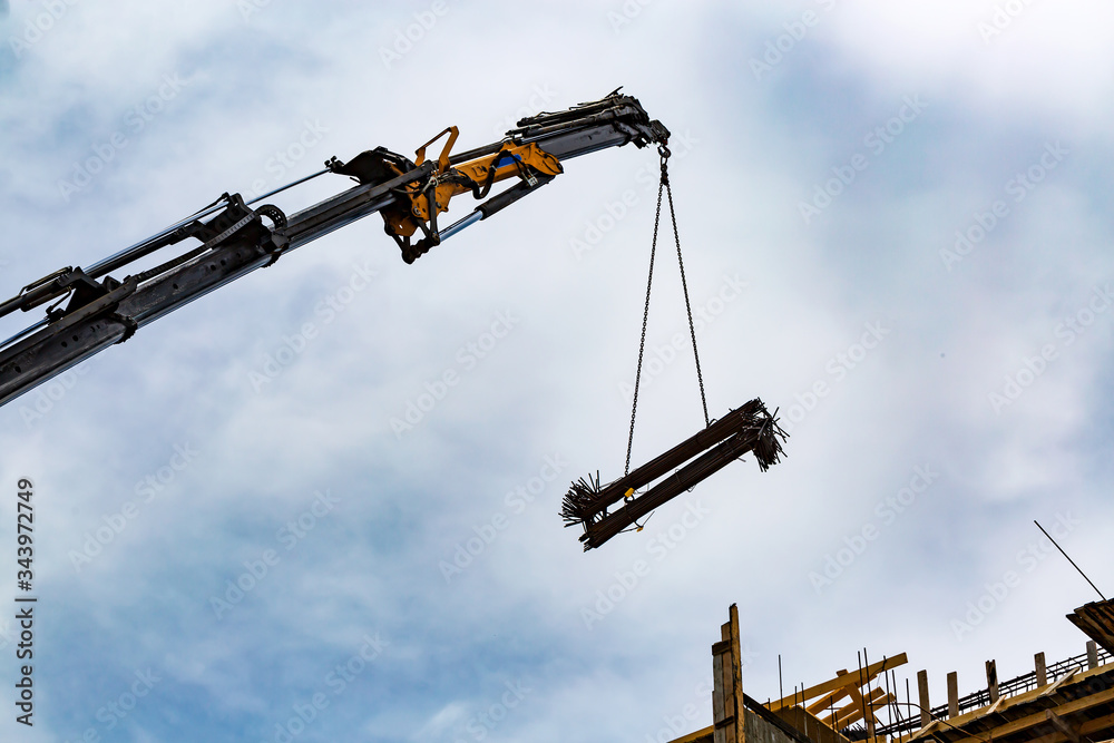 mobile crane to manage concrete joist for assembly huge construction. mobile crane to manage concrete joist for assembly huge construction.