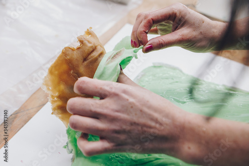 wax and silicone casting revealing lips in artist studio photo