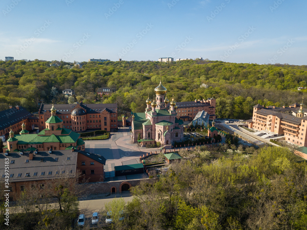 Aerial drone view. Orthodox monastery among the forest in Kiev.
