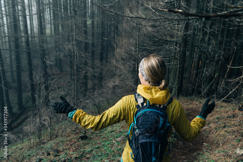 A woman hiking through a trail near Mt. Hood in Oregon. photo