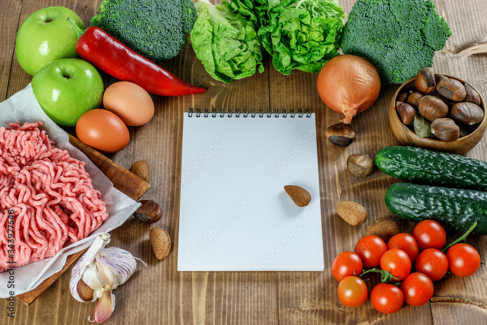 Ketogenic diet food background with a paper list for notes or recipes . Products with vitamins and minerals for keto diet. Ketogenic diet food background with a paper list for notes or recipes . Products with vitamins and minerals for keto diet.
