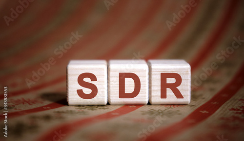 SDR Serpstat Domain Rank - concept on wooden cubes on a striped background photo