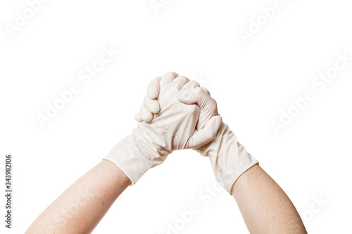hands in a medical sterile gloves shows hands together gesture of support and trust, concept mock up isolated on white background with copy space.