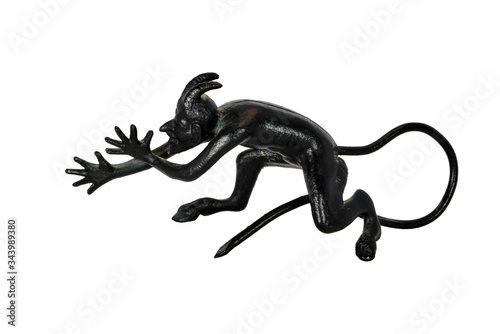 Fotografi Cast-iron statuette of devil isolate on a white background close-up