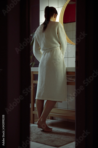 Back view of female in bathroom stock photo