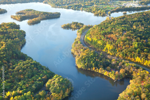Aerial view of curving road along Mississippi River during autumn photo