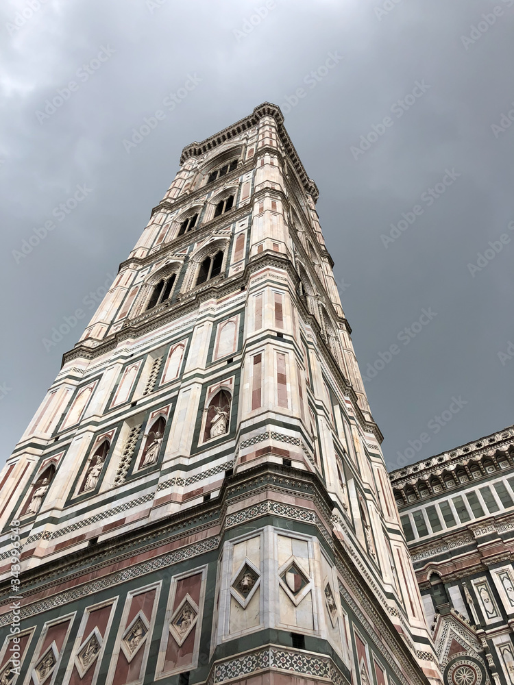 Giotto's Bell Tower, Piazza del Duomo; Florence, Italy; towering above.