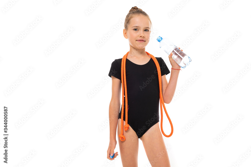 young gymnast champion in sportswear holds a water bottle with a mock-up on a white background with copy space young gymnast champion in sportswear holds a water bottle with a mock-up on a white background with copy space