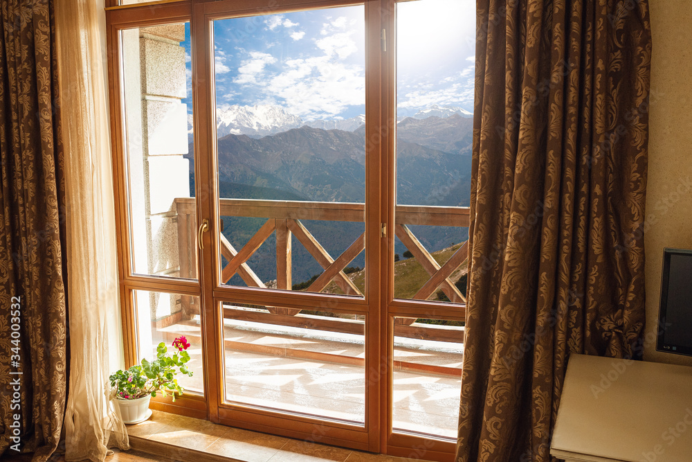 Closed window and beautiful picture outside, nature view, resort and resting. Sunny summers or spring day with green grass, sea or ocean, bright and vibrant colors. Tourism, hotels or home mood. Closed window and beautiful picture outside, nature view, resort and resting. Sunny summers or spring day with green grass, sea or ocean, bright and vibrant colors. Tourism, hotels or home mood.