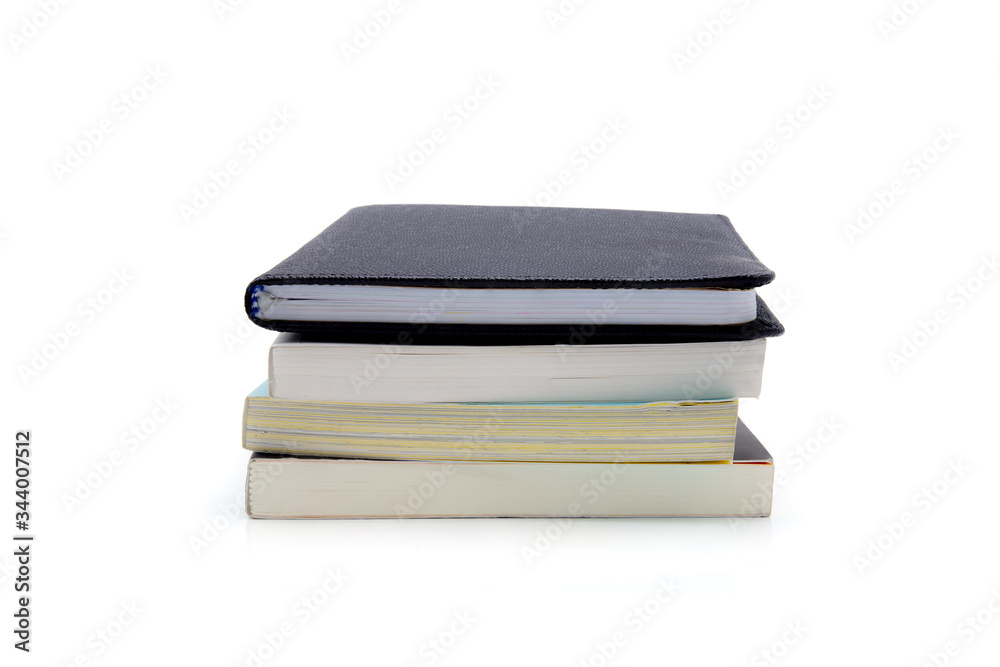 Stack of book isolated on white background, notebook and textbook, heap of stationery and note, learning and study, heap diary or literature, education and business collection concept. Stack of book isolated on white background, notebook and textbook, heap of stationery and note, learning and study, heap diary or literature, education and business collection concept.
