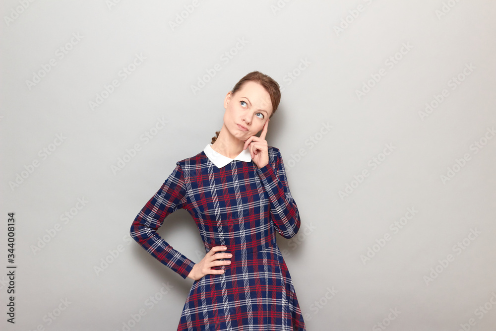 Portrait of thoughtful young woman imagining something in mind Portrait of thoughtful young woman imagining something in mind