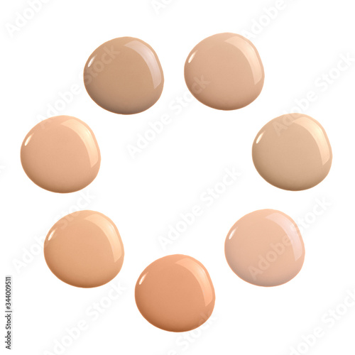 Set of shades of liquid concealer isolated on white. Beige nude liquid foundation smear smudge drop. Collection of different tones of make up concealer. Makeup foundation cream smudge sample swatch