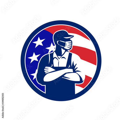 Illustration of an American grocer, supermarket or grocery worker wearing a surgical face mask, hat and overalls arms folded with USA stars and stripes flag set inside circle done in retro style. 
