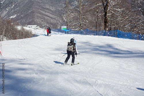 A skier on a slope rides.