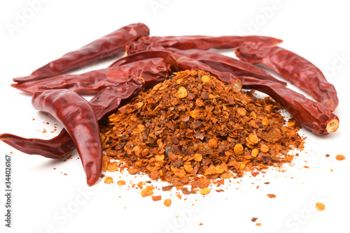 Fotografering Close up,Cayenne pepper (Ground chili) and dried chilli isolated on white background