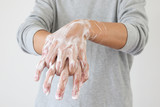Man wash hands with soap for COVID-19 corona virus prevention concept