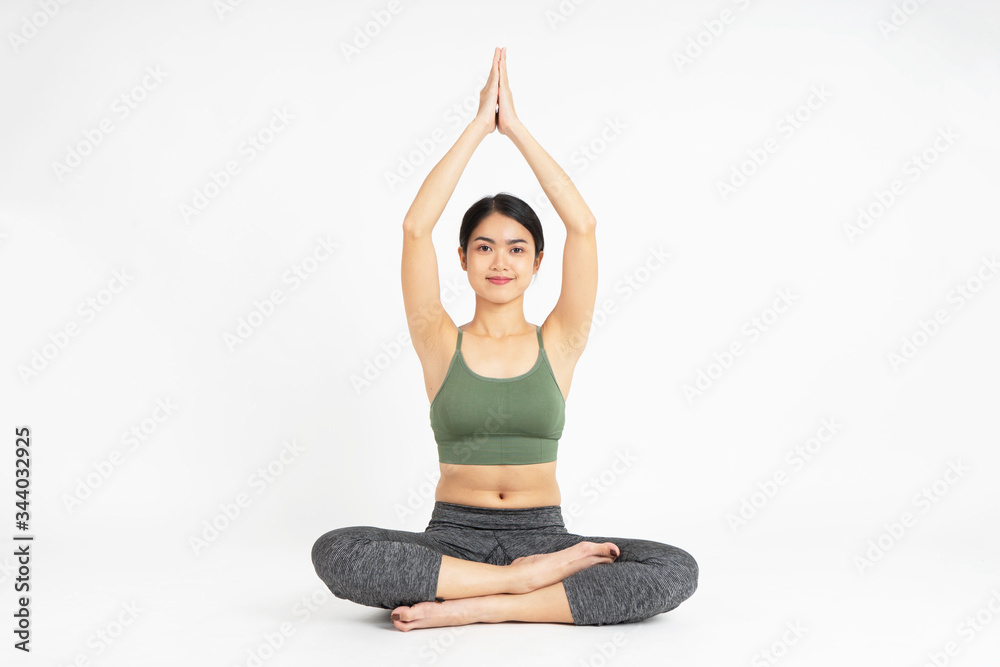 Young Asian woman yoga meditating on white background Young Asian woman yoga meditating on white background