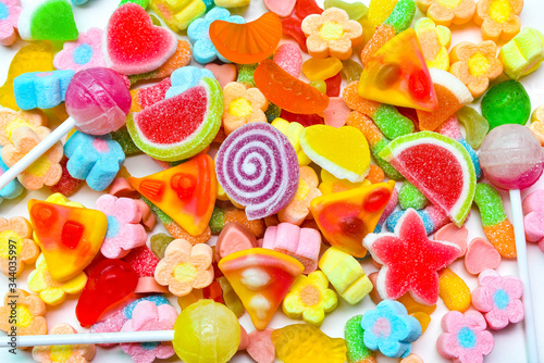 Many colorful lollipops with a sweet flavor placed on the plate.