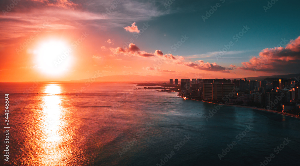 Top view of beautiful sunset in Hawaii island with building and ocean, aerial drone shot Top view of beautiful sunset in Hawaii island with building and ocean, aerial drone shot