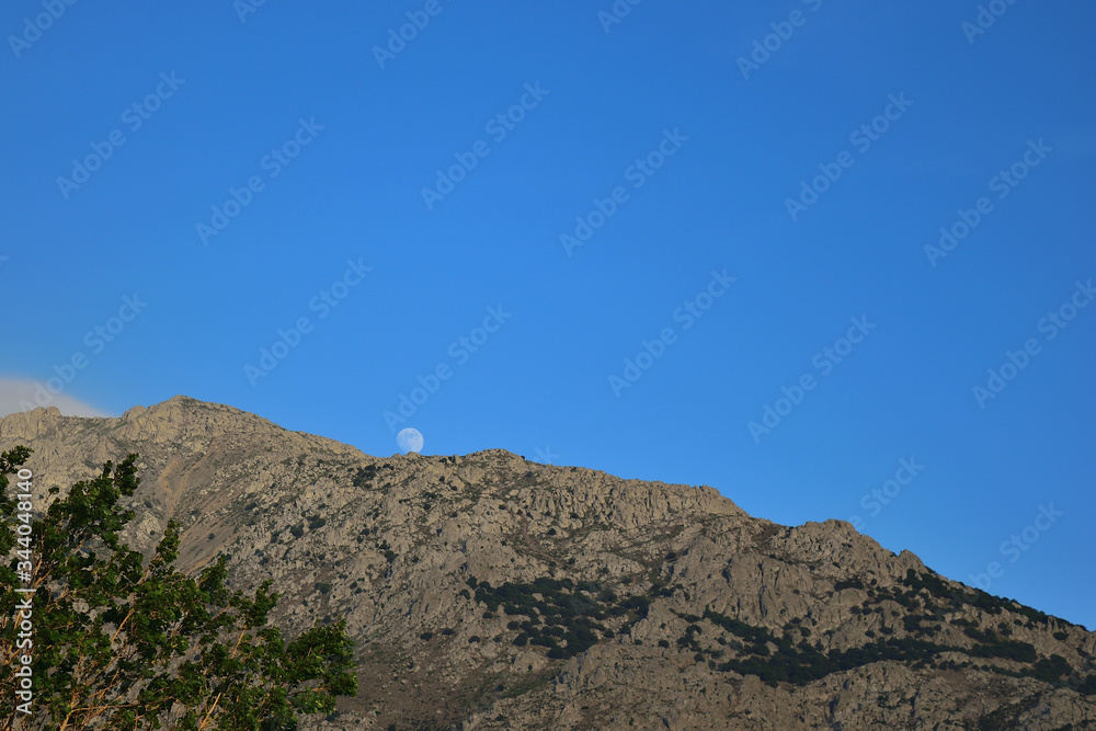Moon over Saos mountain - view from Therma beach, Samothraki, Greece Moon over Saos mountain - view from Therma beach, Samothraki, Greece