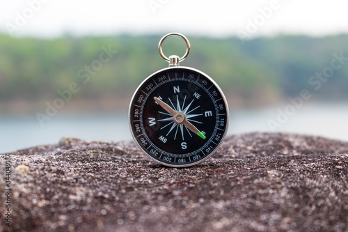 A compass on a mountain road