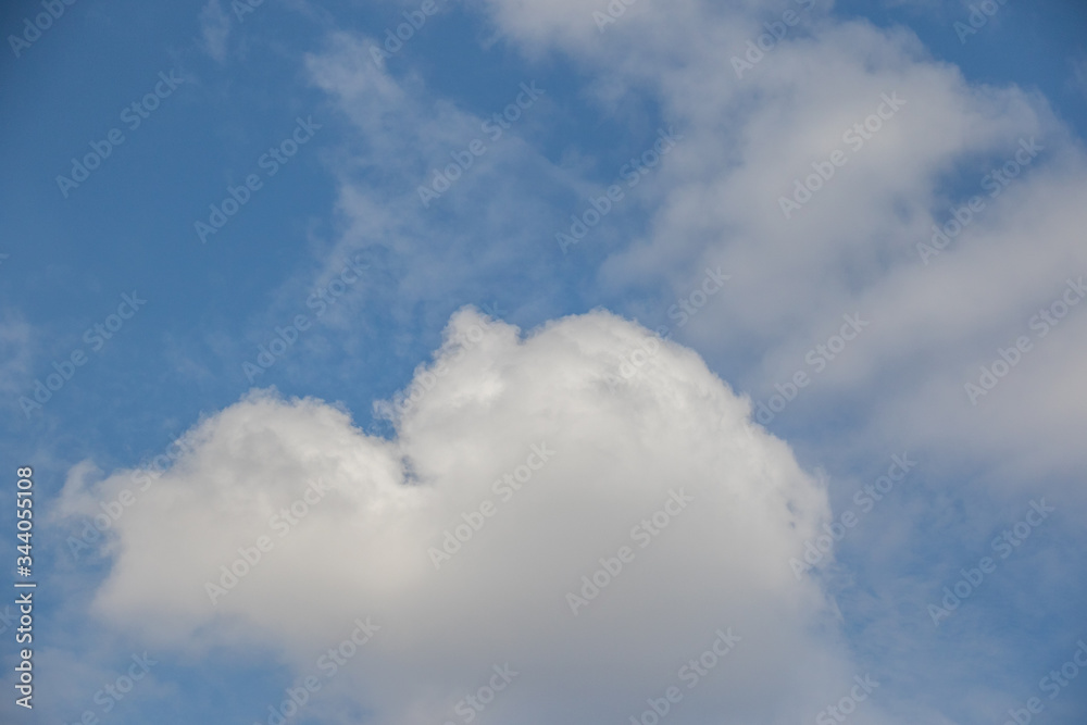 White clouds isolated in a clear cold blue sky on the Highveld of South Africa image for background use White clouds isolated in a clear cold blue sky on the Highveld of South Africa image for background use