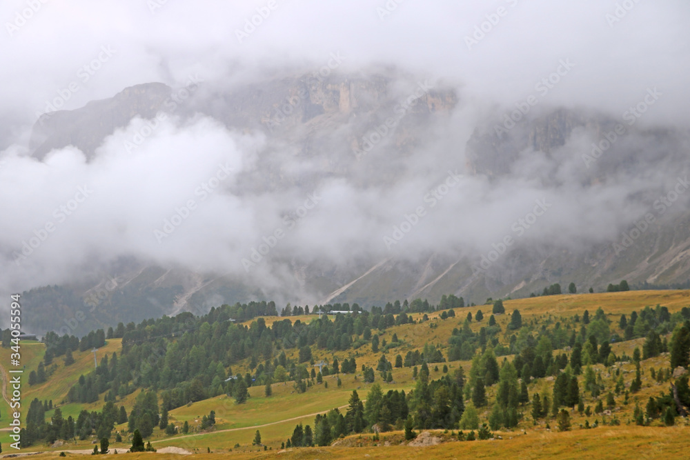 Dolomitic massif in the Italian Dolomites with cloudy sky. Italy.