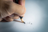 stumbles in life,write a life words on white paper but Pencil lead broken
