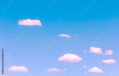 Wall Mural small pink clouds floating on blue sky with day light