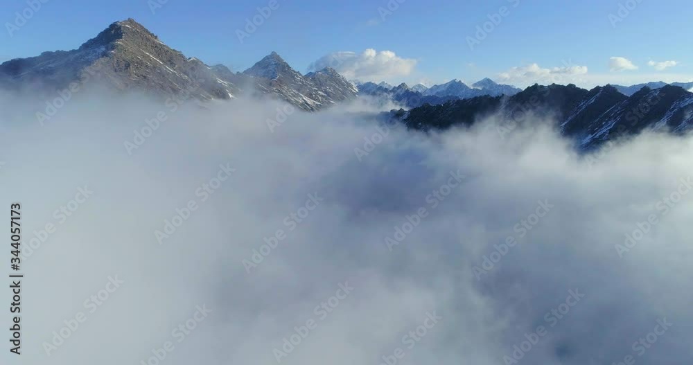 4k aerial view of drone flying through the sea of clouds in the mountain valley in the morning 4k aerial view of drone flying through the sea of clouds in the mountain valley in the morning