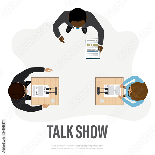 Talk show in broadcasting studio on television. Two politicians debate, journalist asks questions.