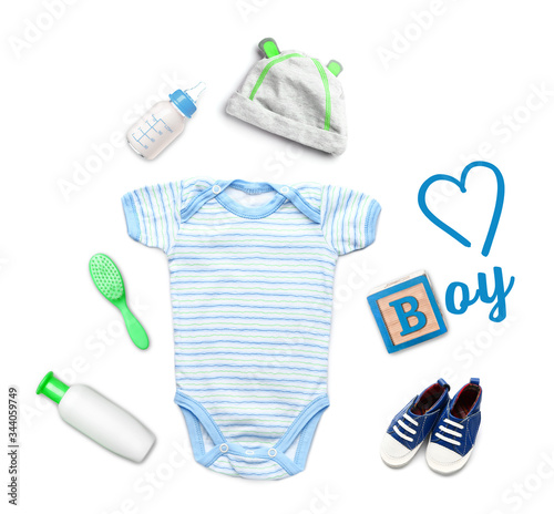 Composition with baby clothes and accessories on white background