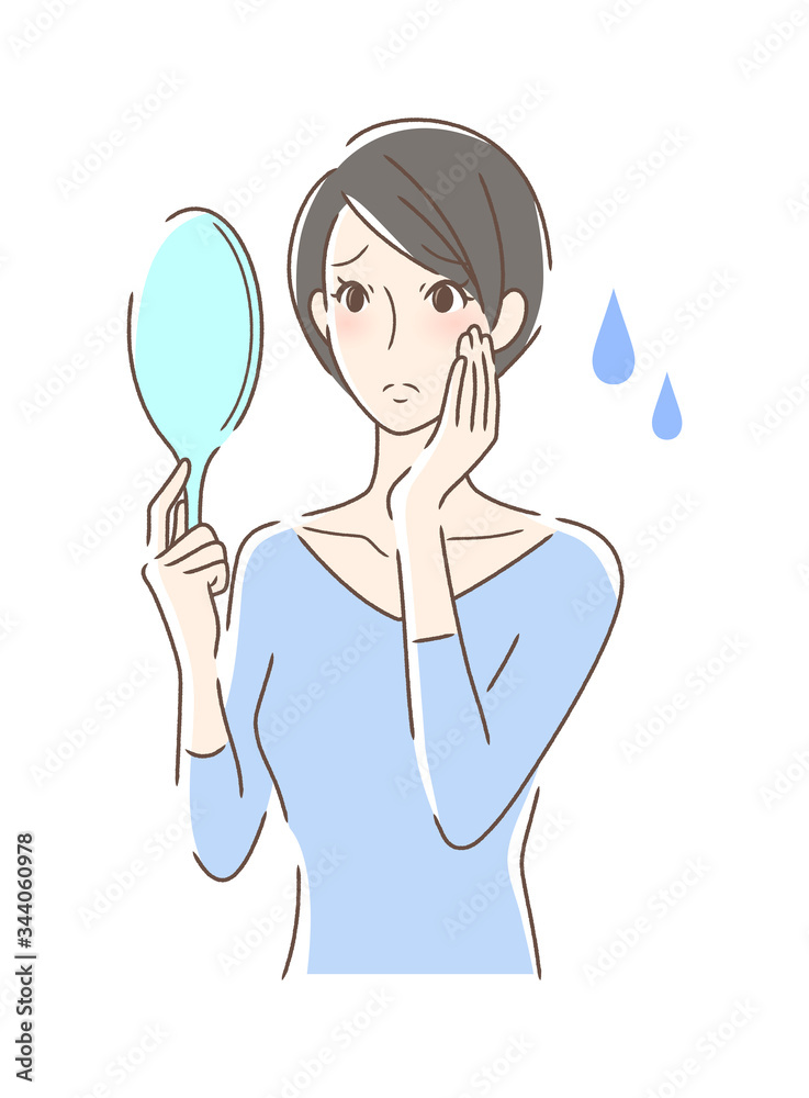 不安な表情で手鏡を見る女性 不安な表情で手鏡を見る女性