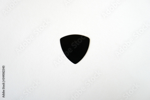 pick guitar on white background, handmade plastic pick guitar