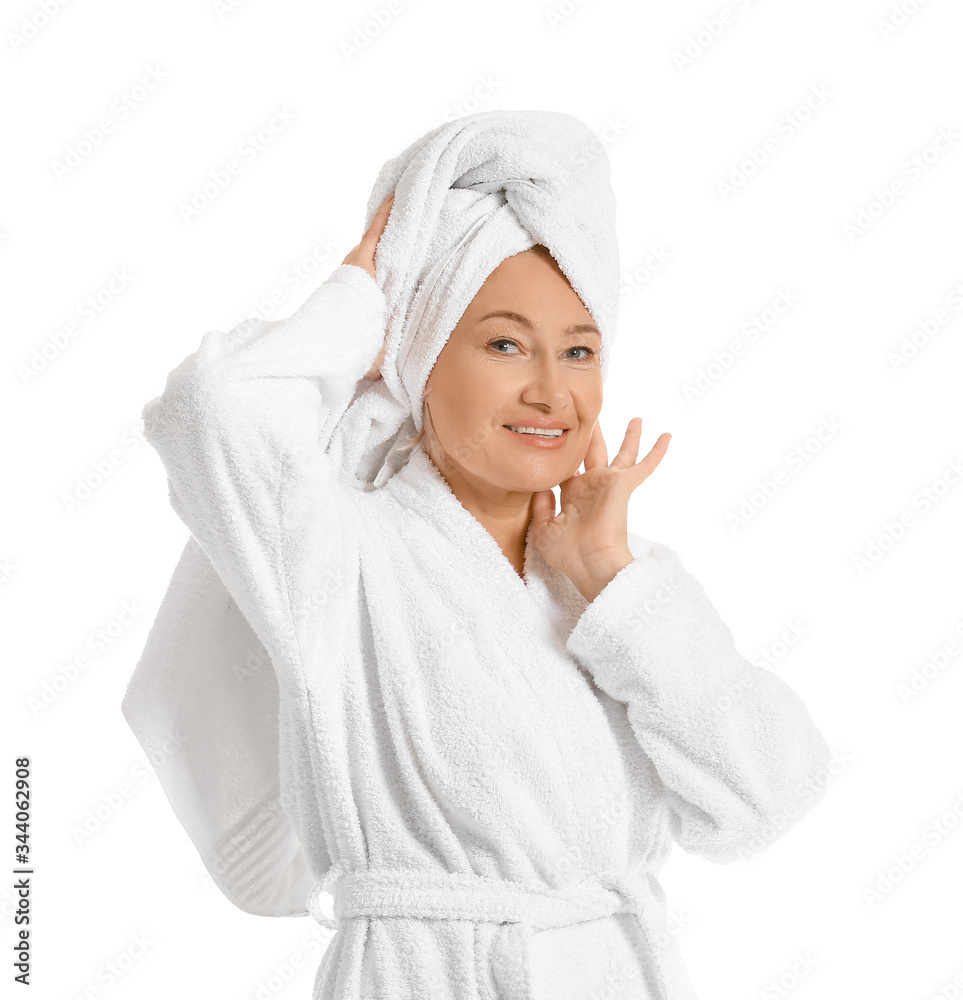 Mature woman in bathrobe on white background Mature woman in bathrobe on white background