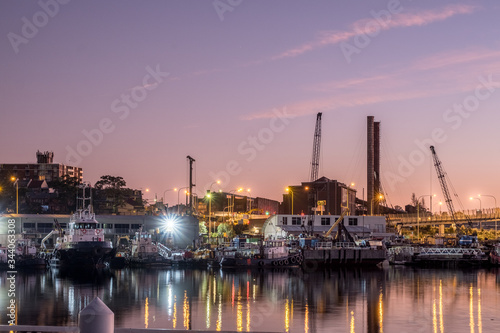 marina at dawn with abandoned power station in the background