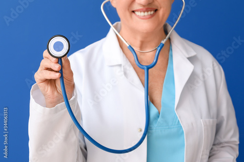 Smiling Doctor Holding Stet...