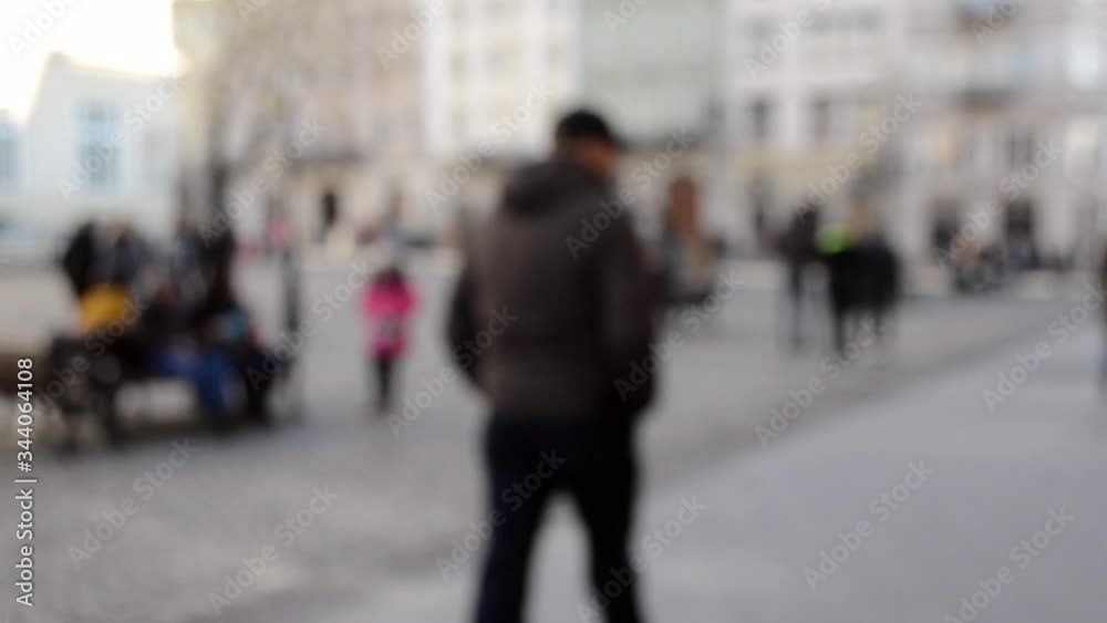 Abstract Defocused Blurred Background of many people on street square Abstract Defocused Blurred Background of many people on street square