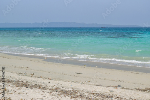 A shot of clean white sandy beach with Indian Ocean and horizon