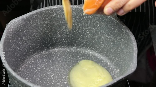 Melting of Desi ghee or clarified butter in a hot pan. photo
