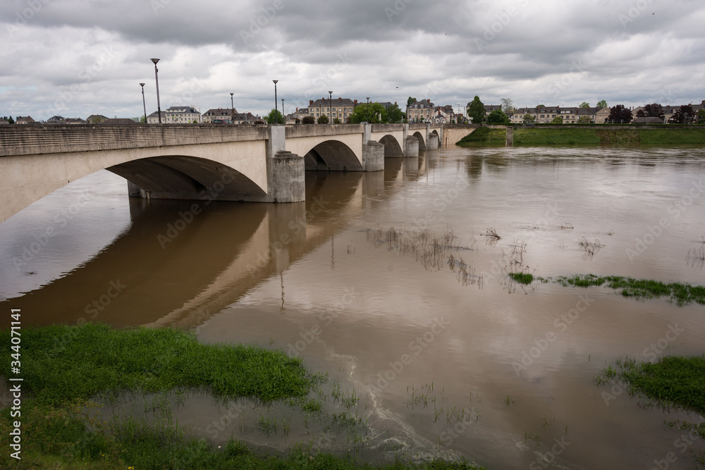 Fototapeta premium Bridge across a swollen Loire River at Saumur, France