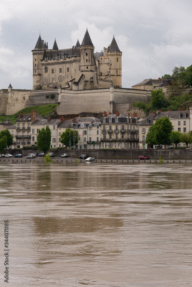 The chateau across a swollen Loire River at Saumur, France