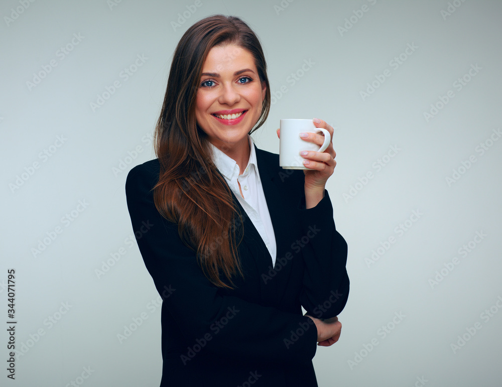 Smiling business woman in black suit holding white coffee cup. Smiling business woman in black suit holding white coffee cup.