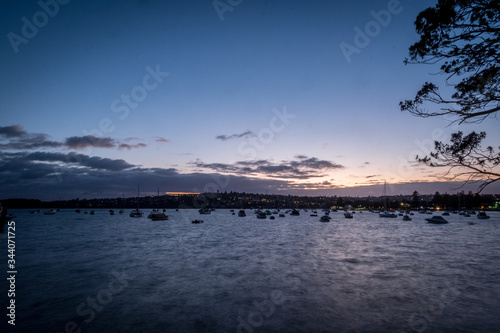 boats facing into the wind at dawn on the bay