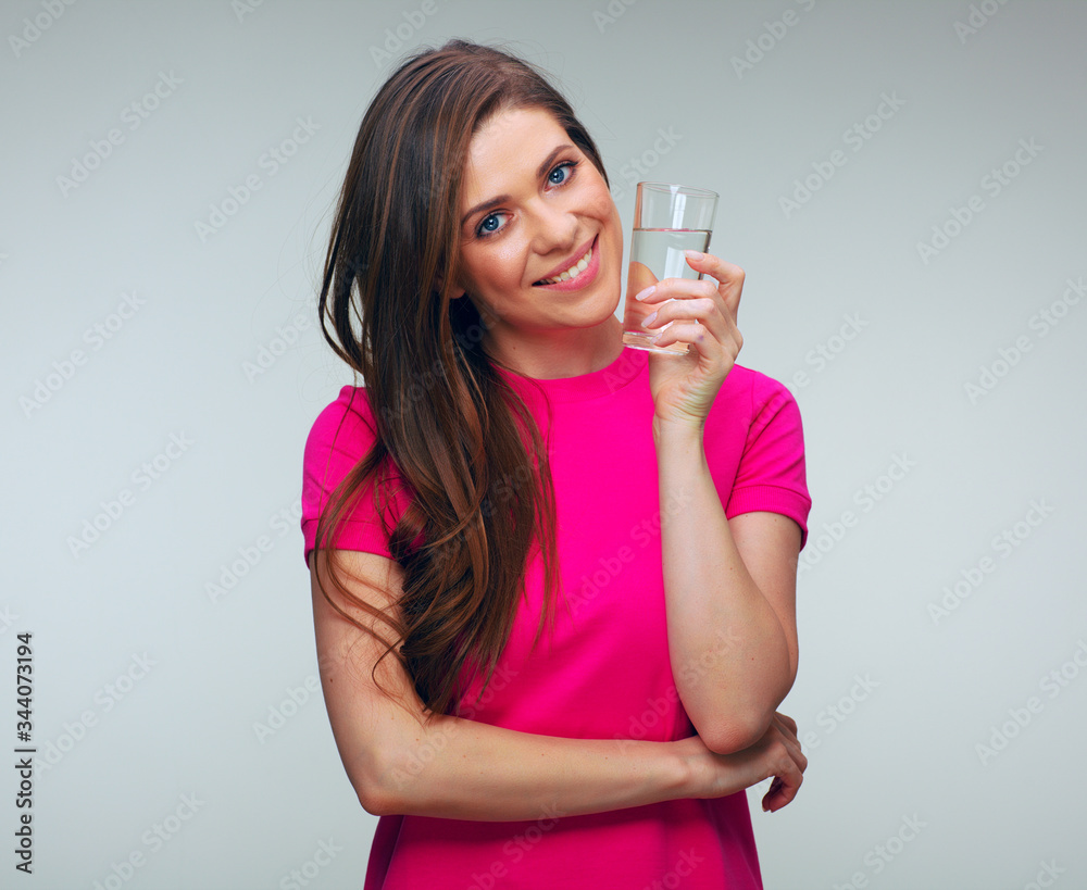 Smiling woman in red dress holding water glass. Smiling woman in red dress holding water glass.
